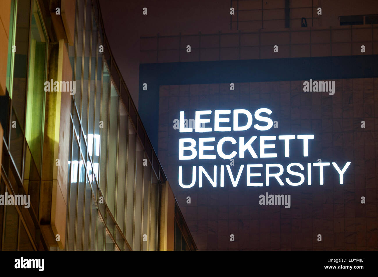 evening shot of Leeds Beckett University signage lit up Stock Photo