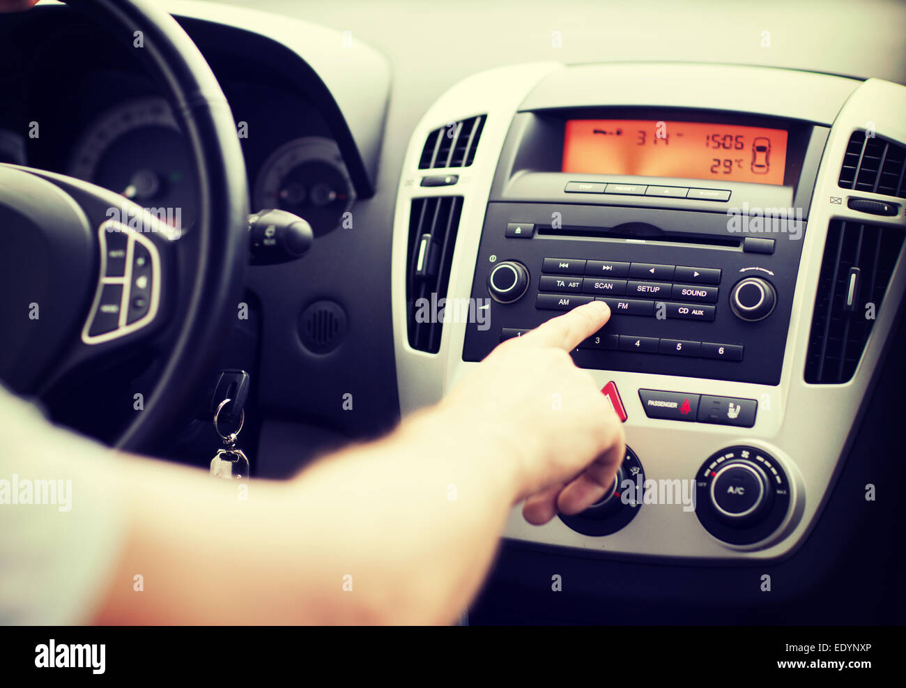 man using car audio stereo system Stock Photo