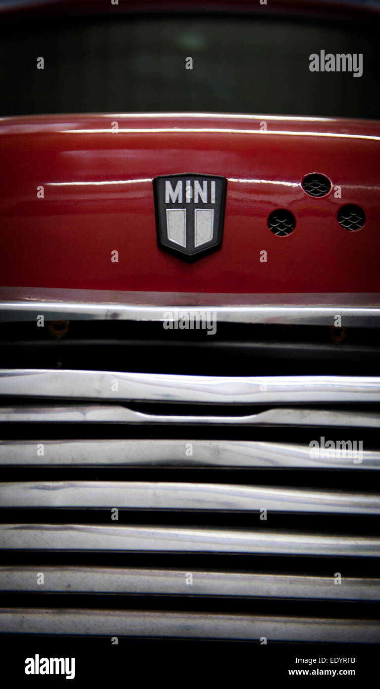 Photo of a Retro Mini Cooper Car Logo Badge on a Red Mini Cooper Car.  Editorial Photo - Image of chrome, motor: 144682971