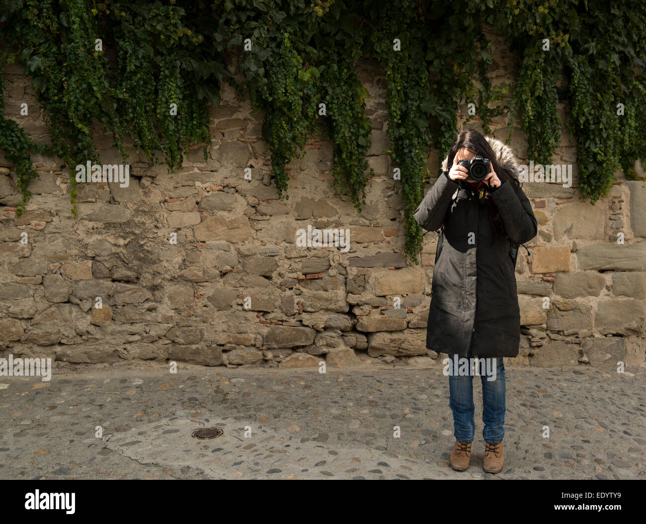 female using nikon camera Dslr slr long coat. credit: LEE RAMSDEN / ALAMY Stock Photo