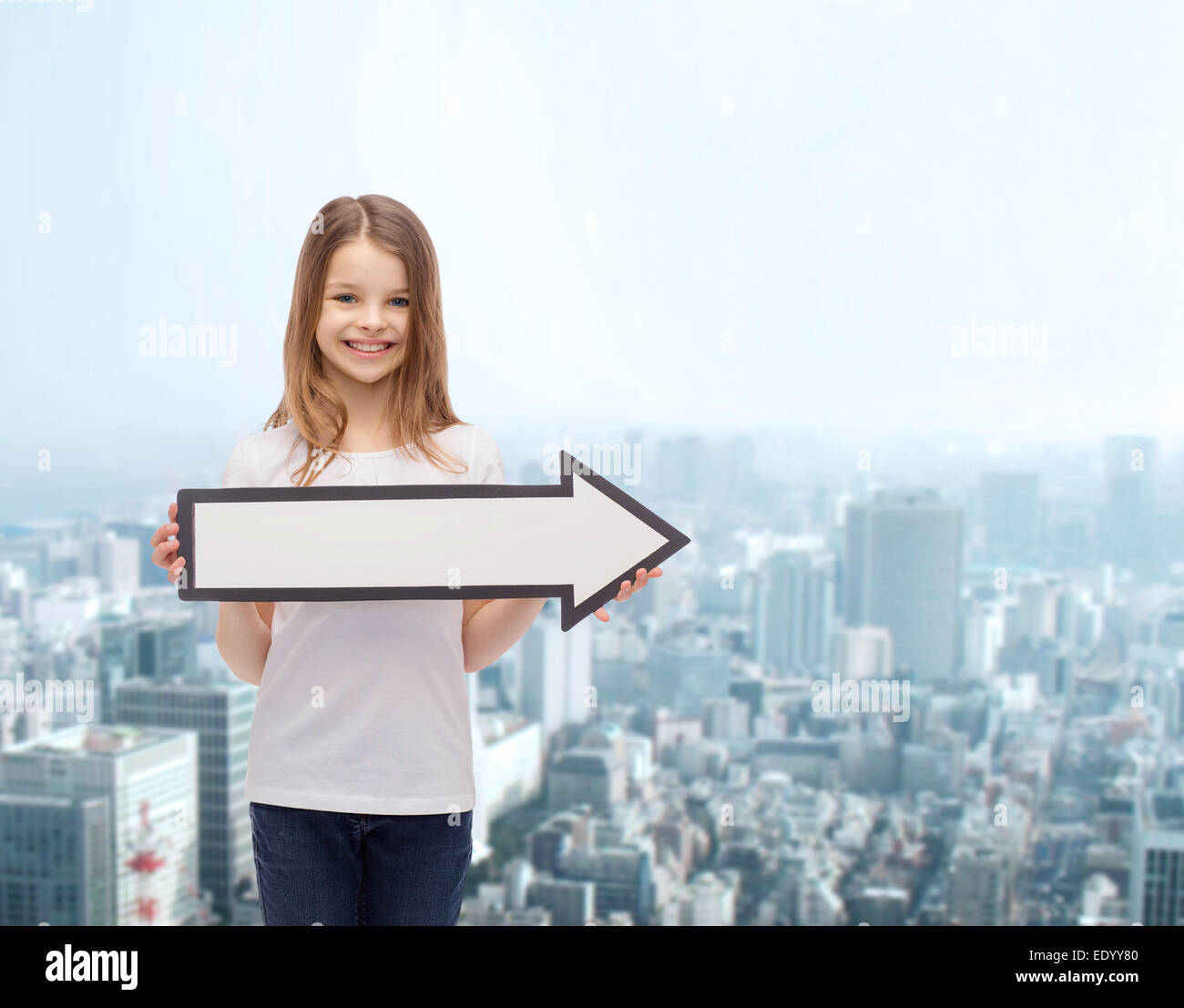 smiling girl with blank arrow pointing right Stock Photo - Alamy