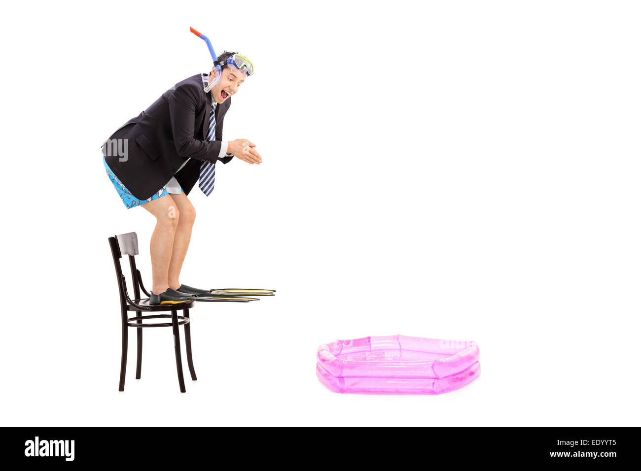 Young businessman ready to jump into a baby pool isolated on white background Stock Photo