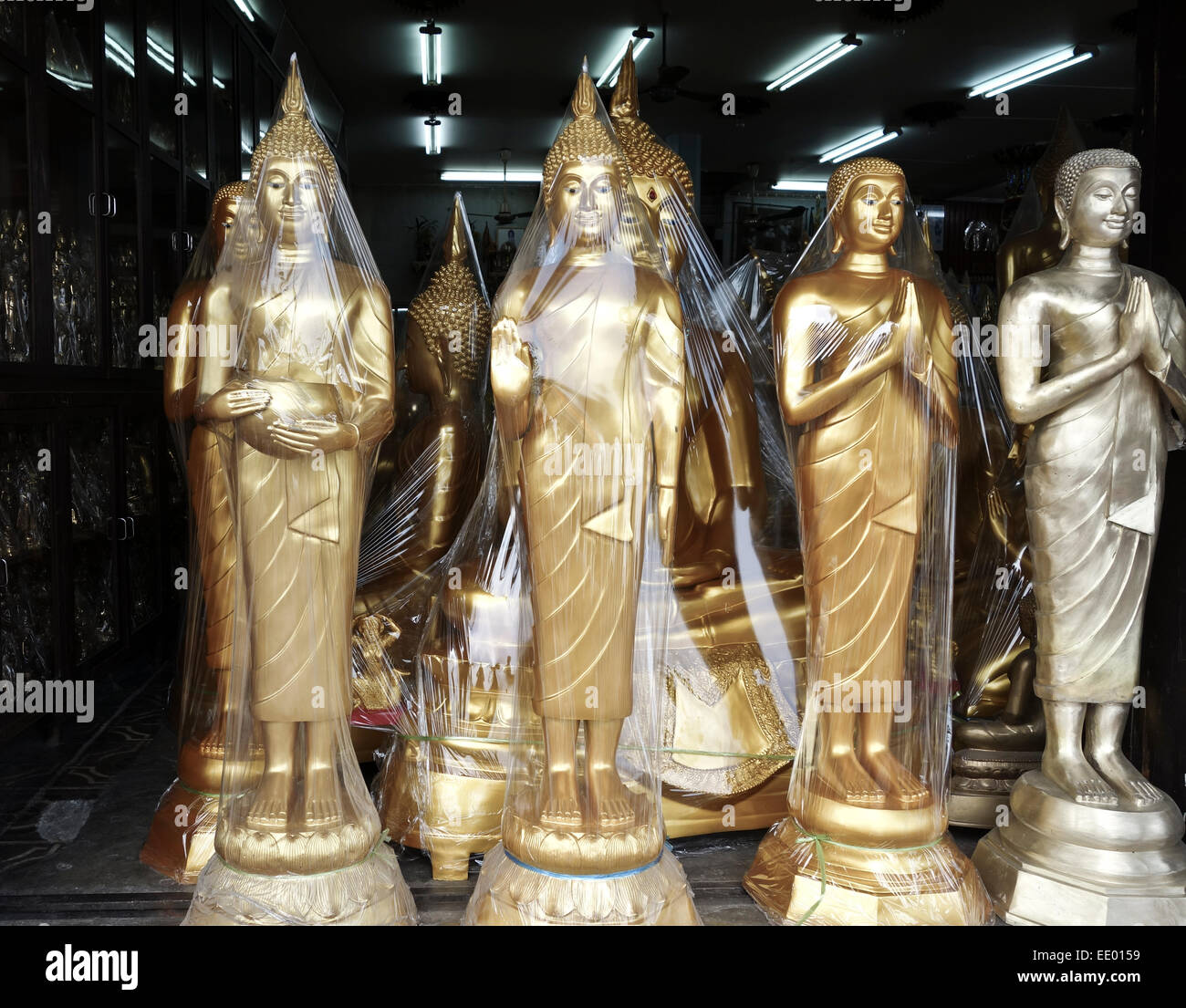 Buddha golden statues packed at manufactury on street in Bangkok, Thailand, Southeast Asia. Stock Photo
