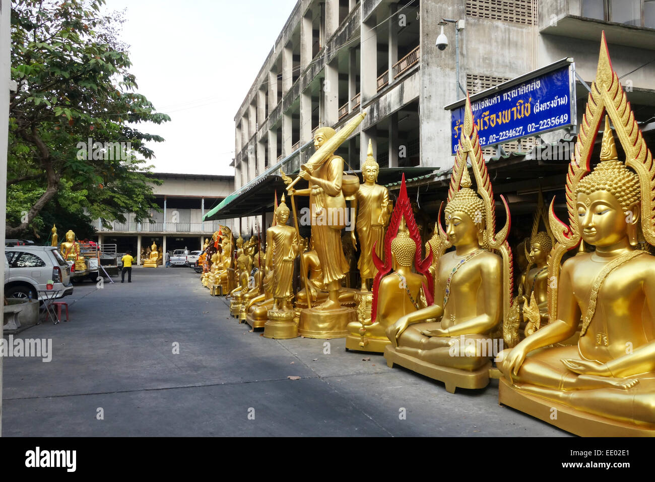 Buddha golden statues at manufactury on street in Bangkok, Thailand, Southeast Asia. Stock Photo