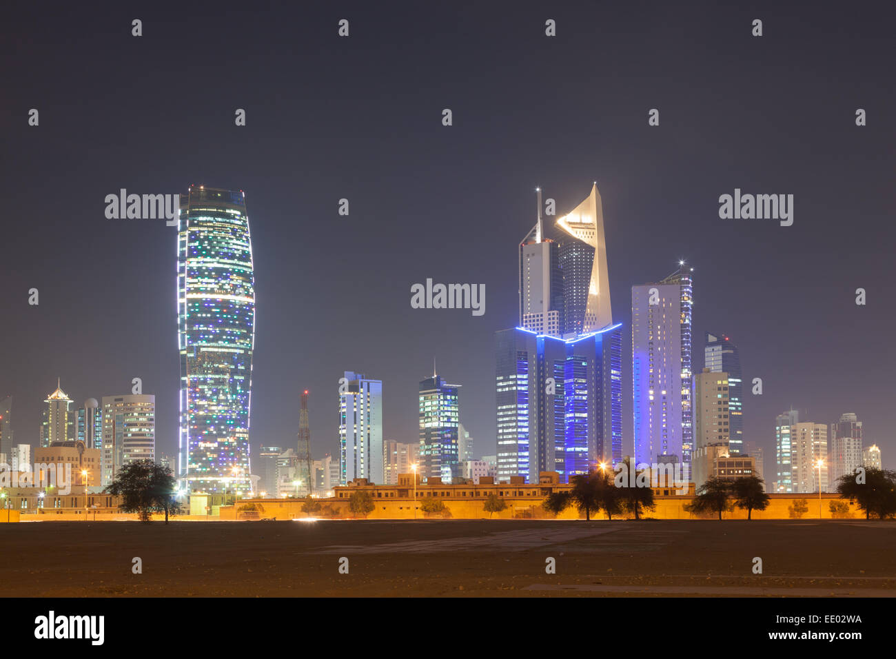 Skyline of Kuwait City at night Stock Photo