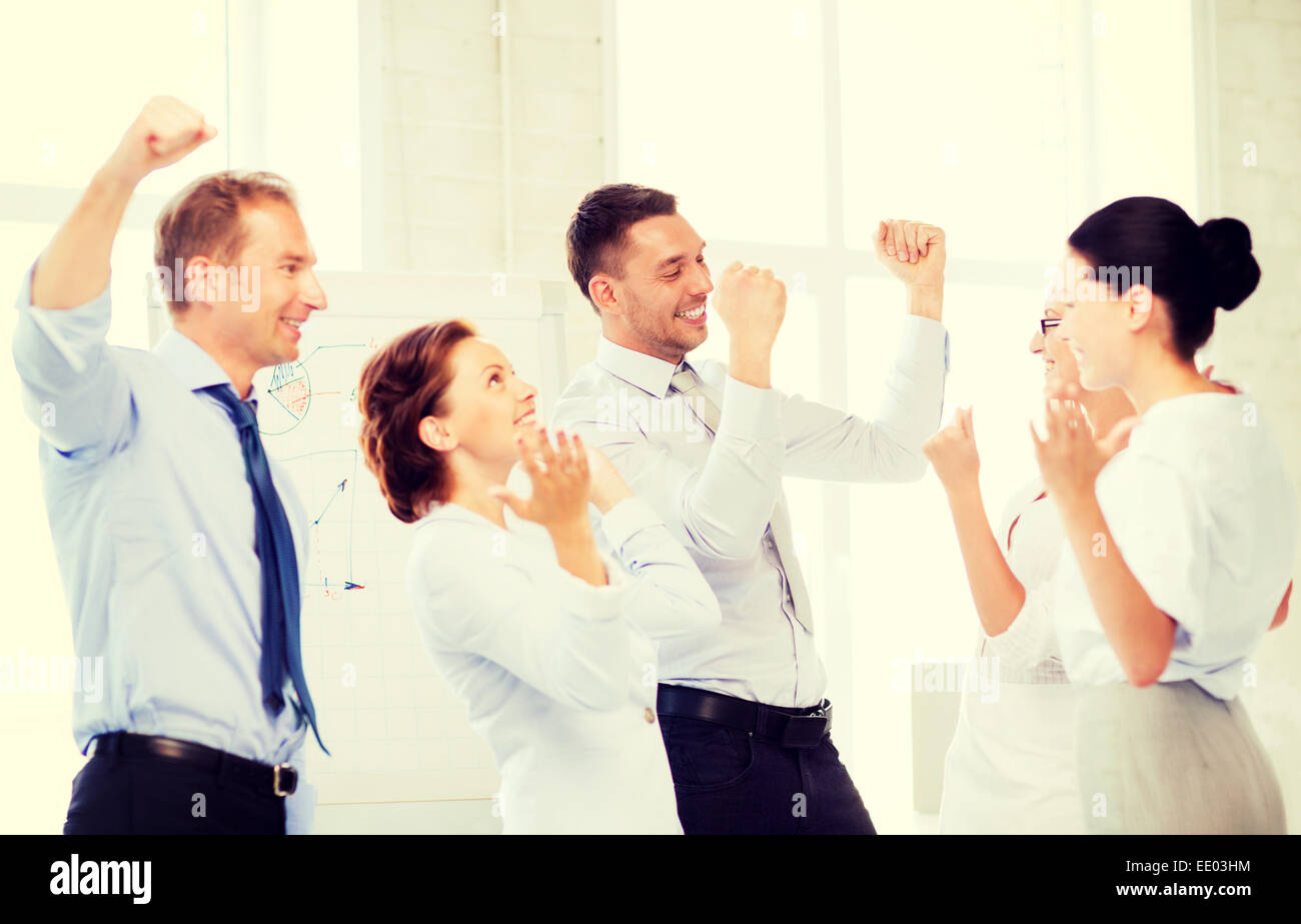 business team celebrating victory in office Stock Photo - Alamy