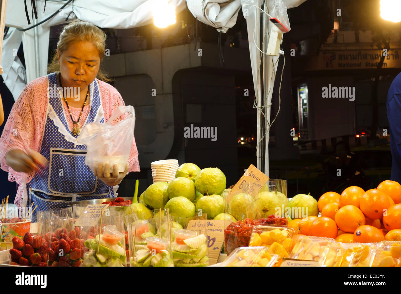Fruit stall displaying guava fruit, night street market around MBK shopping centre, Bangkok, Thailand, Southeast Asia. Stock Photo