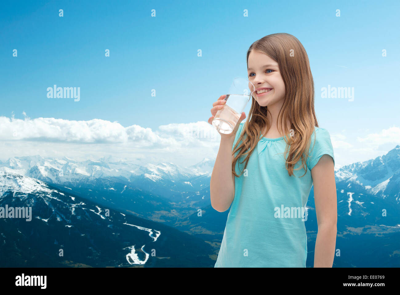 smiling little girl with glass of water Stock Photo - Alamy