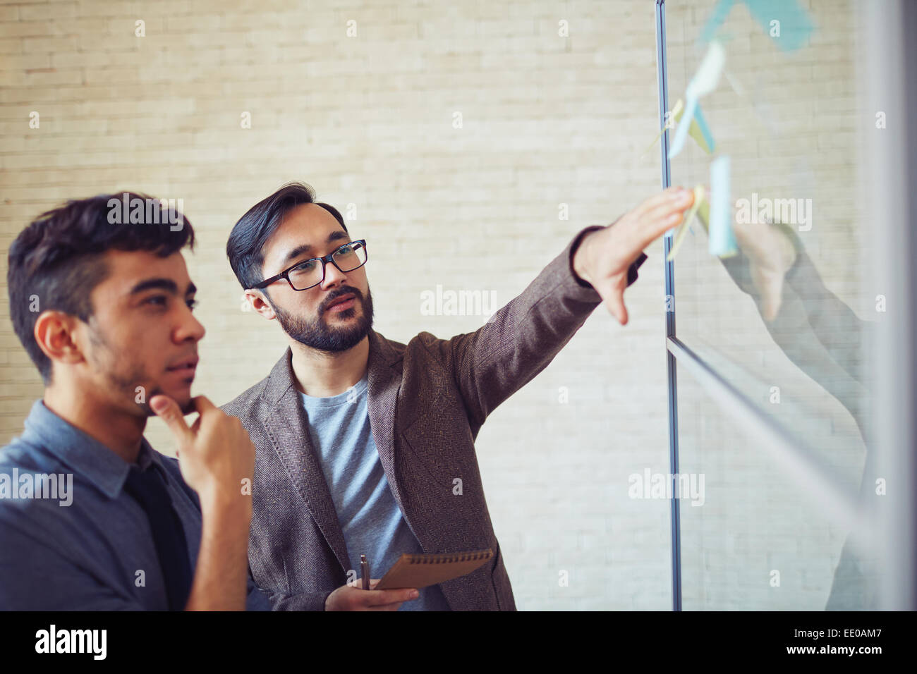 Man Explaining Point Asian businessman explaining point of working plan to colleague Stock ...
