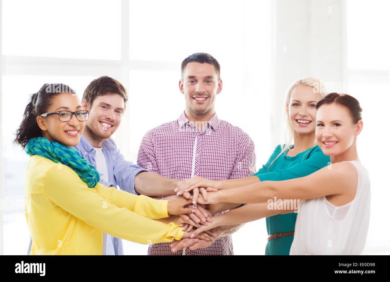 Hands on top of each other business hi-res stock photography and images ...