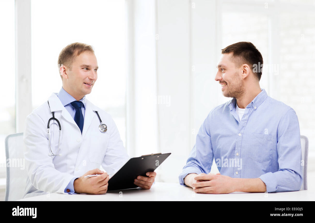 doctor with clipboard and patient in hospital Stock Photo - Alamy