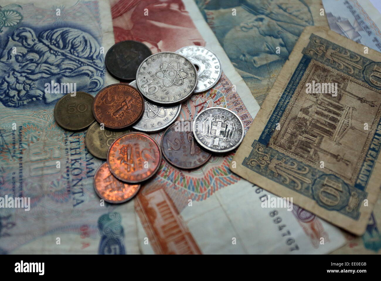 A mixture of old drachma coins and paper notes Stock Photo