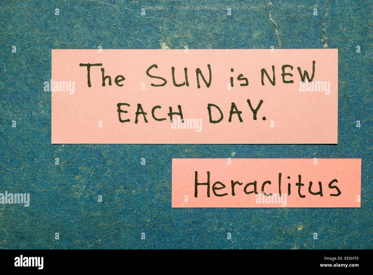 Sun is new each day - ancient Greek philosopher  Heraclitus quote interpretation with pink notes on vintage carton board Stock Photo