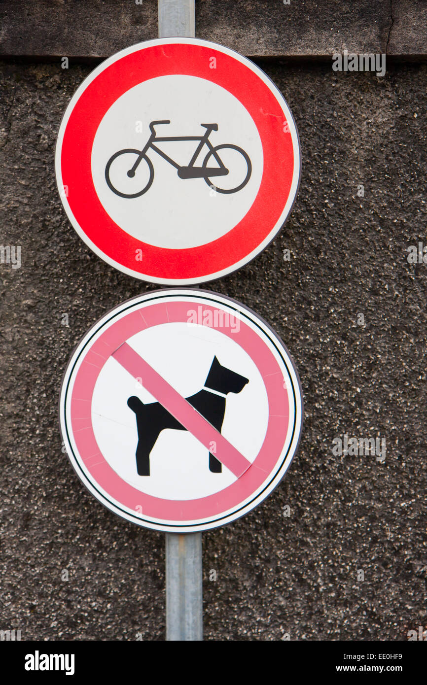 two signs prohibiting bicycles and dogs Stock Photo