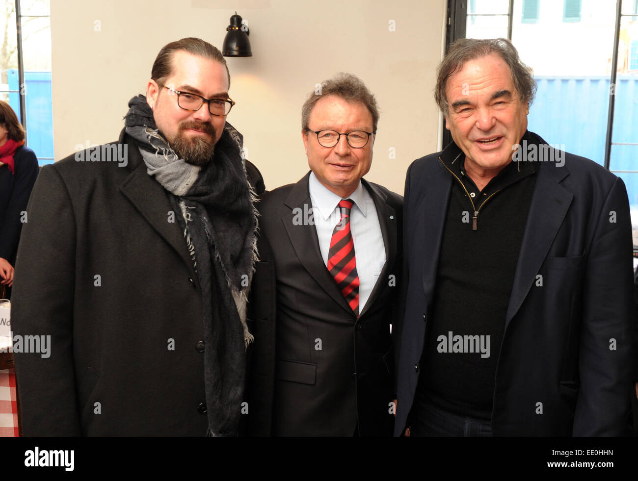 Producer Philip Schulz-Deyle (L-R), CEO of FFF Bayern, Klaus Schaefer, and the US-American director Oliver Stone at a press lunch with the FilmFernsehFonds Bayern (FFF Bayern  - Bavarian Film and Television Fund) in Munich, Bavaria, 12 January 2015. Photo: TOBIAS HASE/dpa Stock Photo