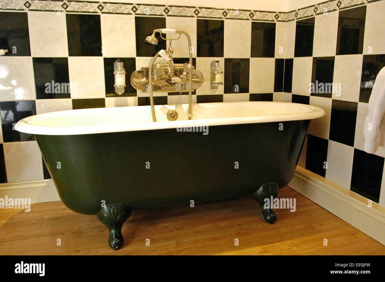 Claw foot bath in tiled bathroom Stock Photo Alamy