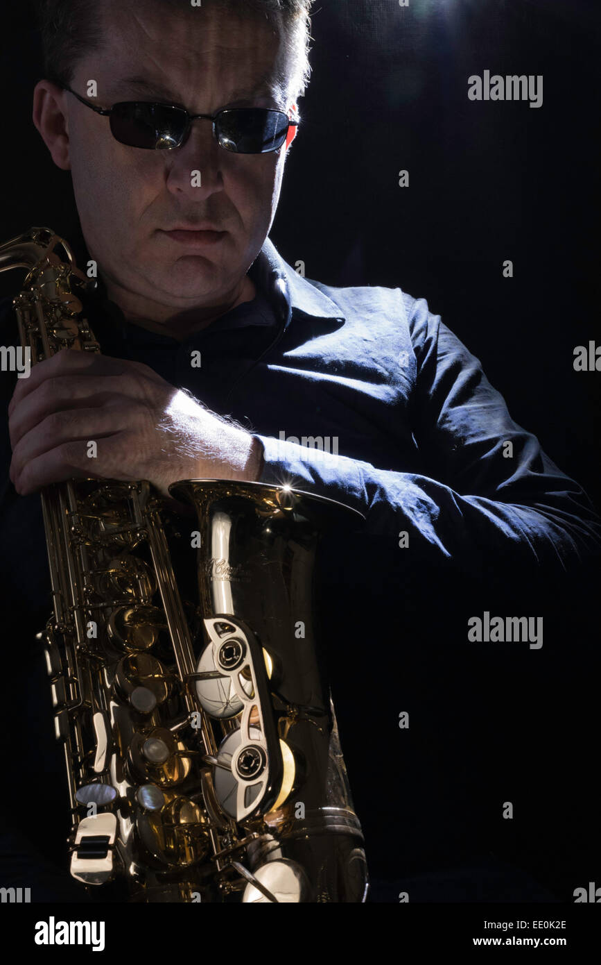 Kind Of Blue. An image of a live saxophonist waiting for the start of the concert. Stock Photo