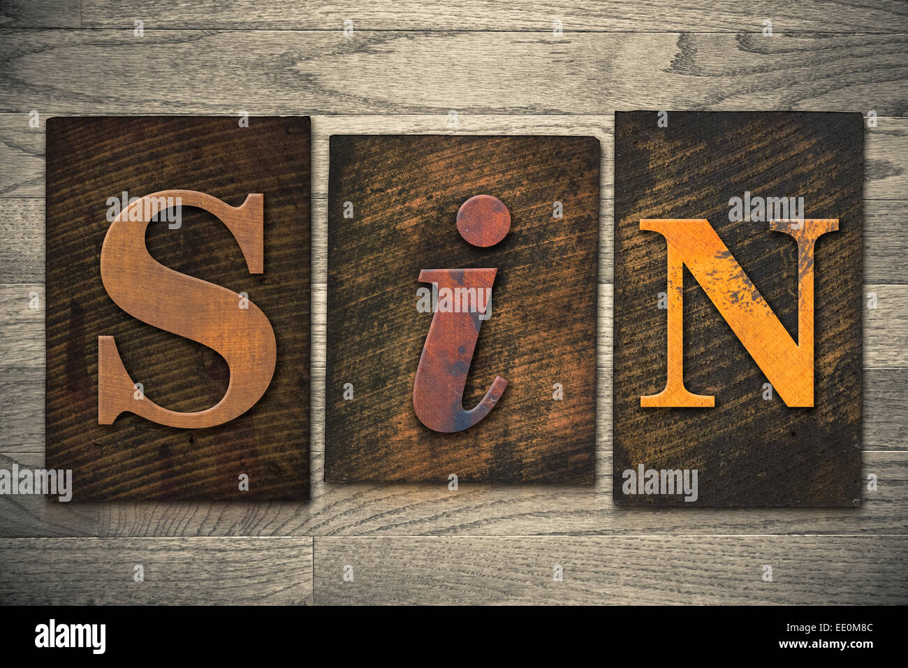 The word 'SIN' written in wooden letterpress type. Stock Photo