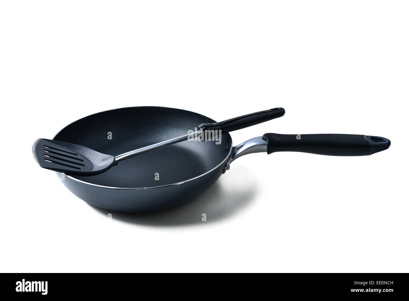 frying pan and spatula on white background Stock Photo