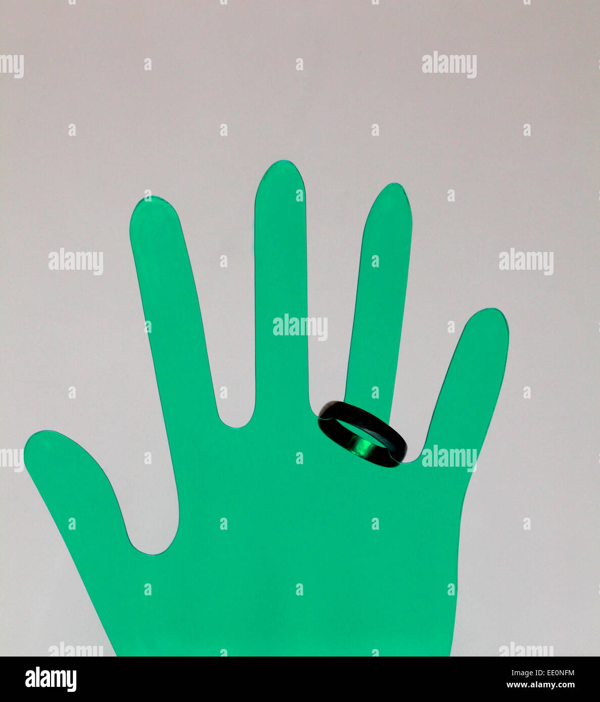 Right Hand print in green color and ring on the ring finger with full view Stock Photo