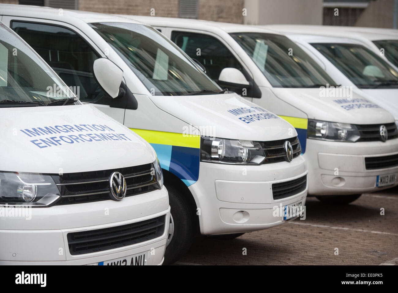 Immigration enforcement vans stand parked in at Home Office immigration