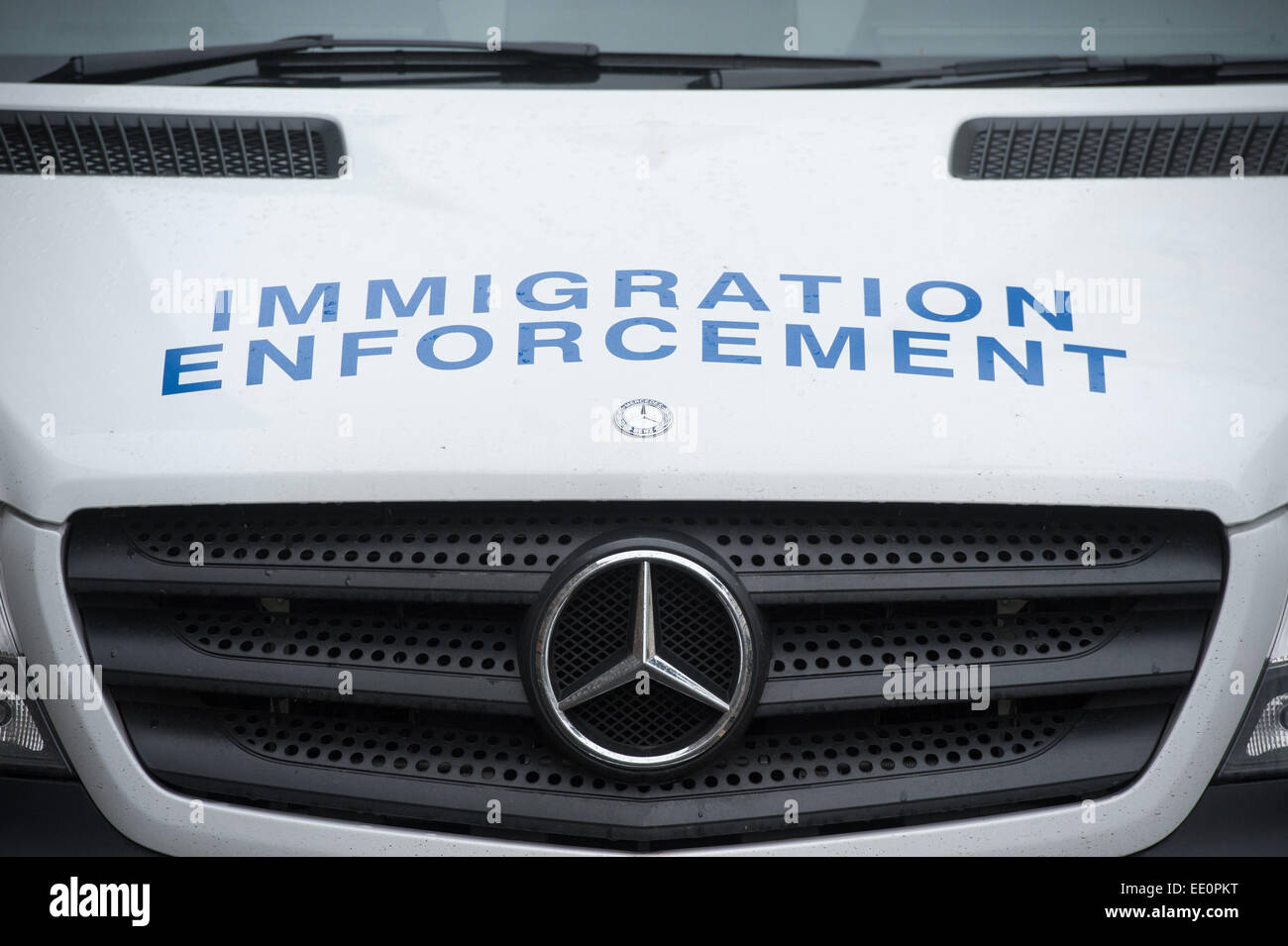 Immigration enforcement vans stand parked in at Home Office immigration