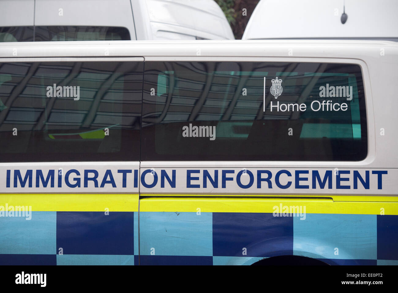 Immigration enforcement vans stand parked hires stock photography and