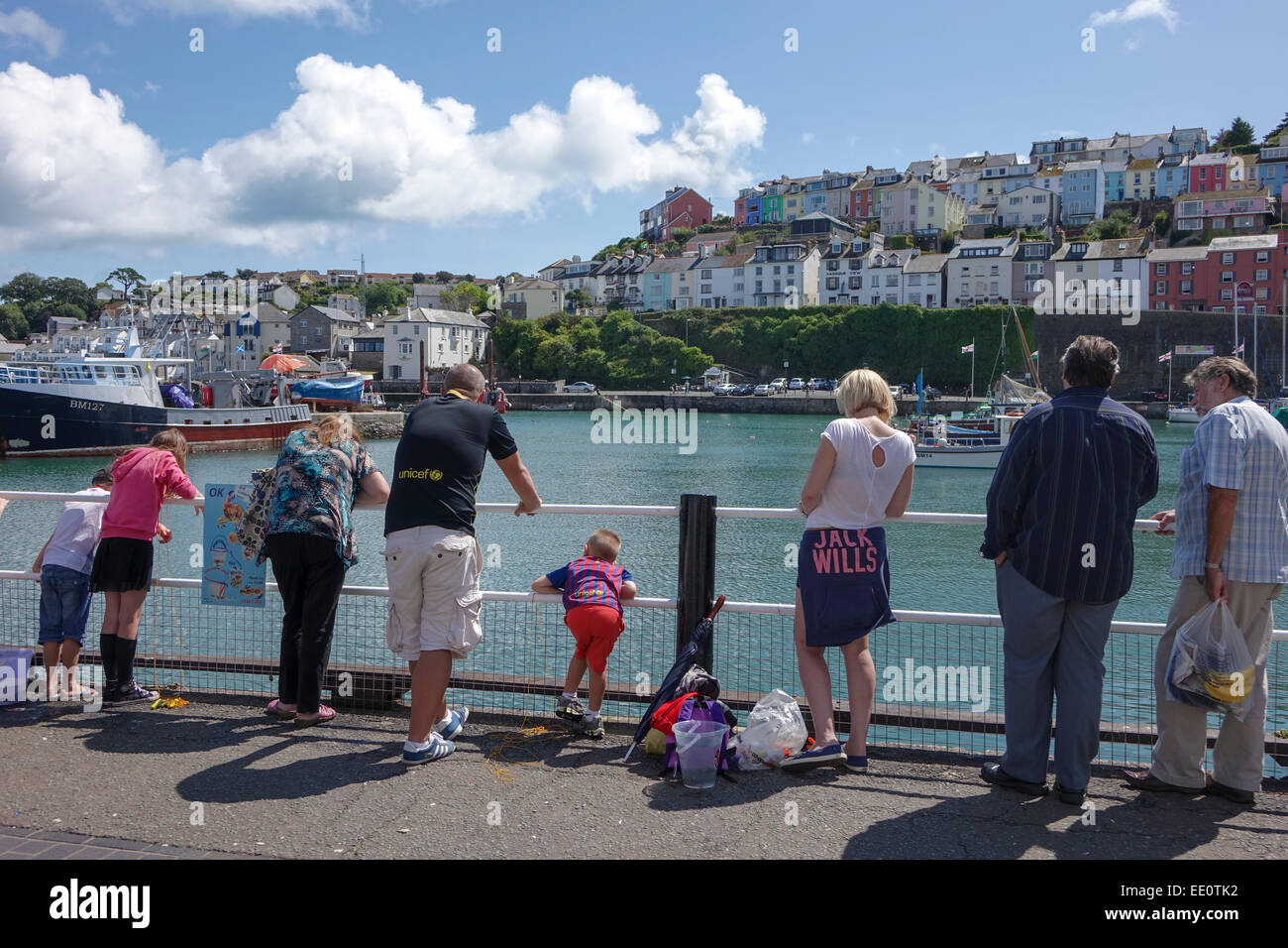 Tourists looking for fish Brixham Torbay 'English Riviera' Devon England UK people looking at harbour harbor Stock Photo