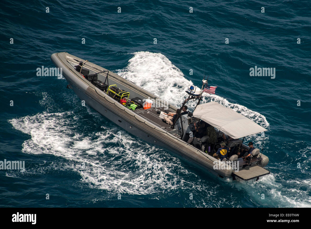 US Navy divers from Mobile Diving and Salvage Unit operate a Tow Fish side scan sonar system off a rigid hull inflatable boat during search efforts to locate AirAsia Flight 8501 black box along with ships from other nations January 12, 2015 in the Java Sea. Stock Photo