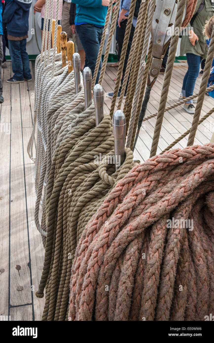 Ropes and belaying pins on the deck of a Tall Ship sailing vessel