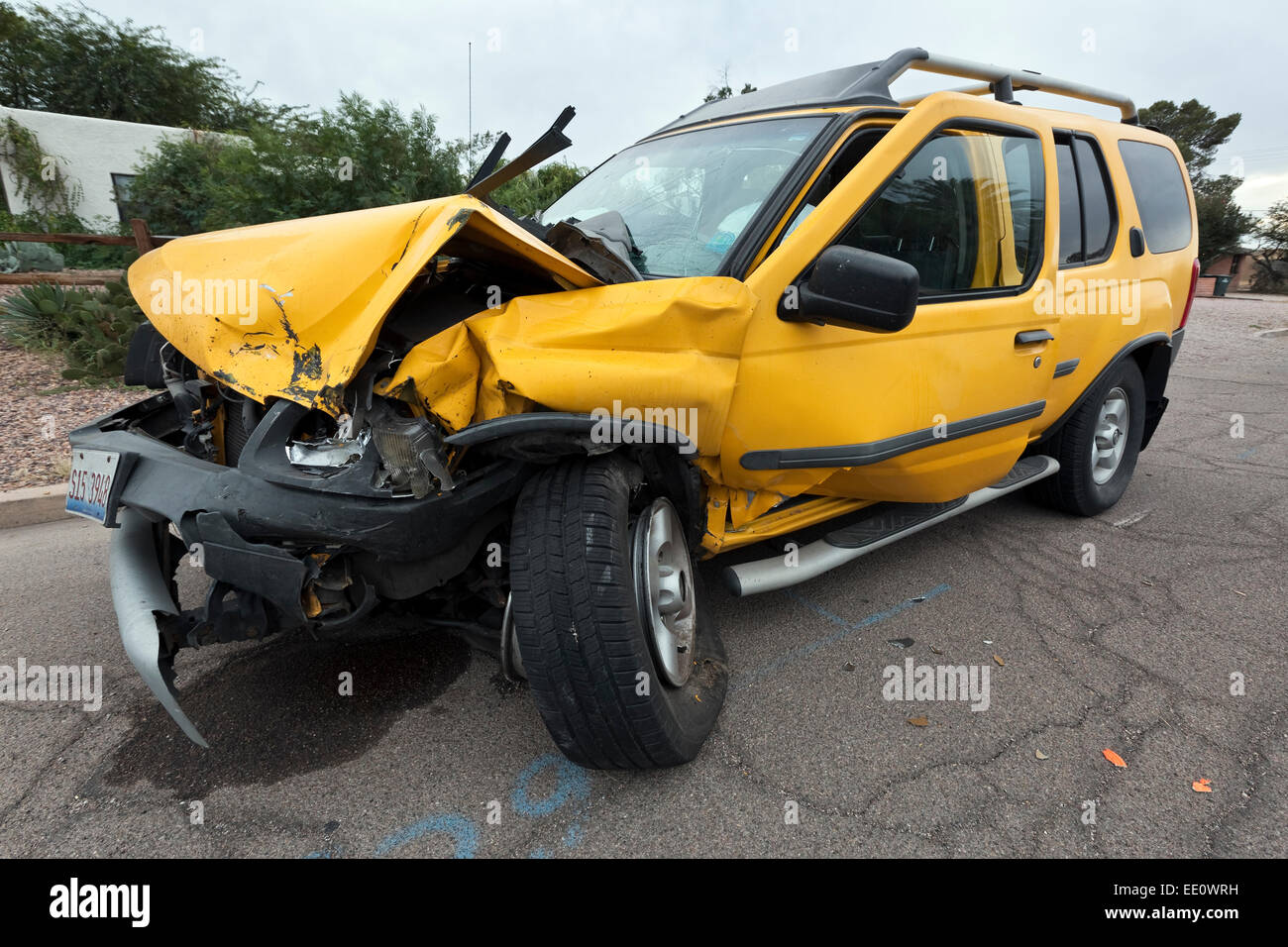 Smashed up yellow SUV Stock Photo