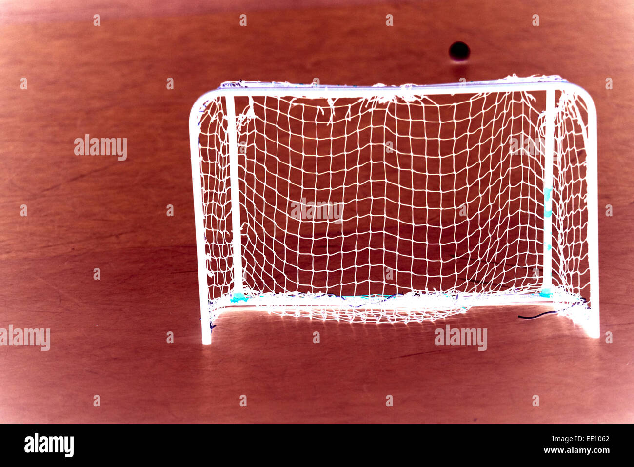 Children boys schoolchildren playing floorball (floor hockey) match in