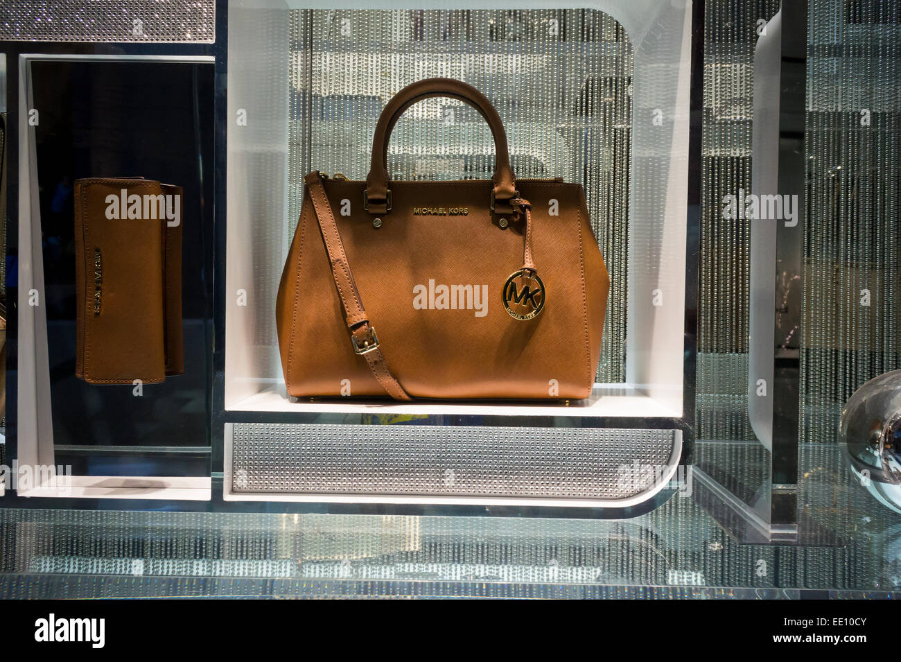 A Michael Kors bag in the window of the brand's store in the Time Warner  Center in New York on Sunday, January 4, 2015. Shares of Michael Kors fell  8.4 percent after
