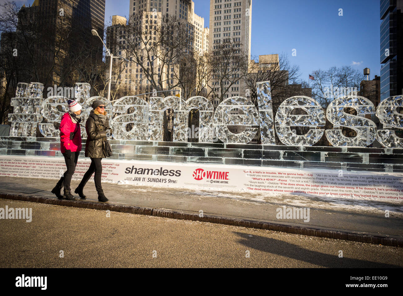 Passer by amuse themselves with an ice sculpture promoting the Showtime series 'Shameless' is displayed in Madison Square in New York on Friday, January 9, 2015. The fifth season of the cable television show starts on Sunday.   (© Richard B. Levine) Stock Photo