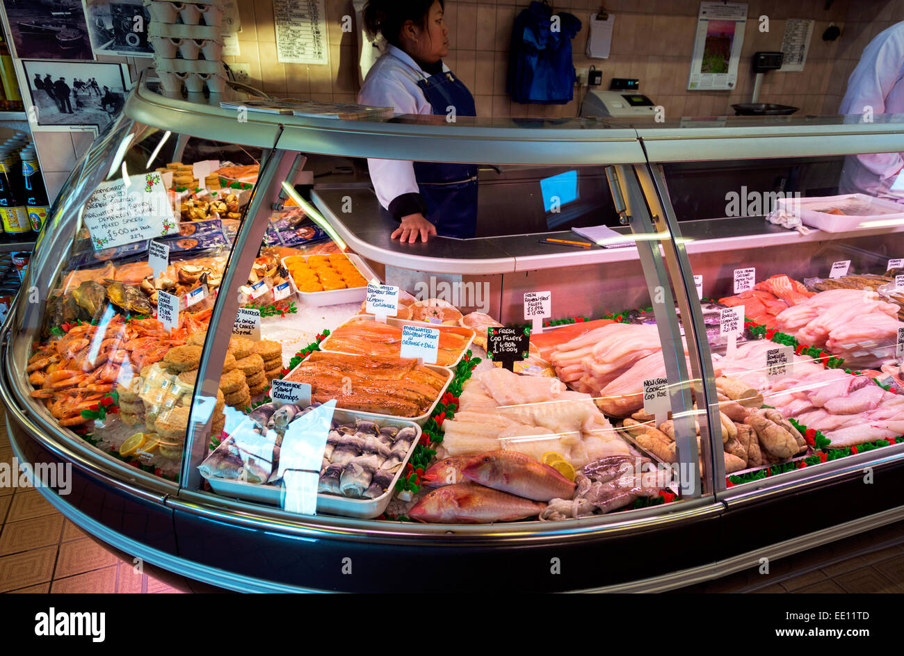 A chilled display stand inside a traditional fishmonger's shop. Stock Photo