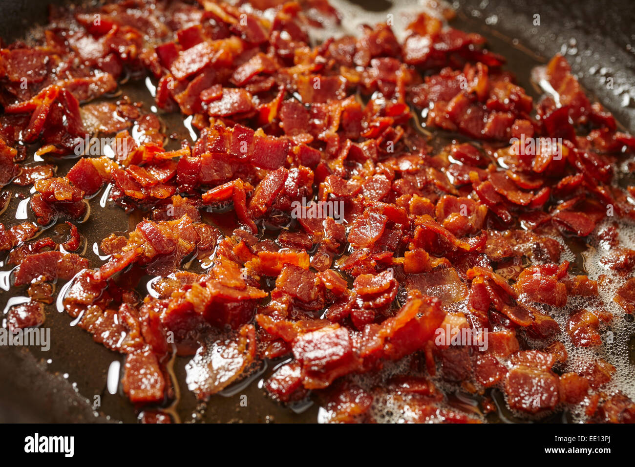 chopped bacon frying Stock Photo