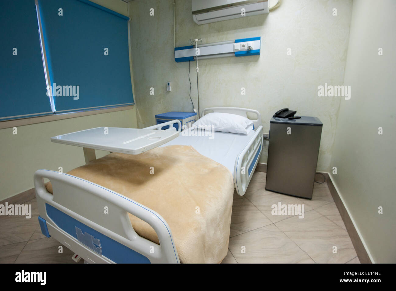 Bed in a private hospital medical center ward room Stock Photo