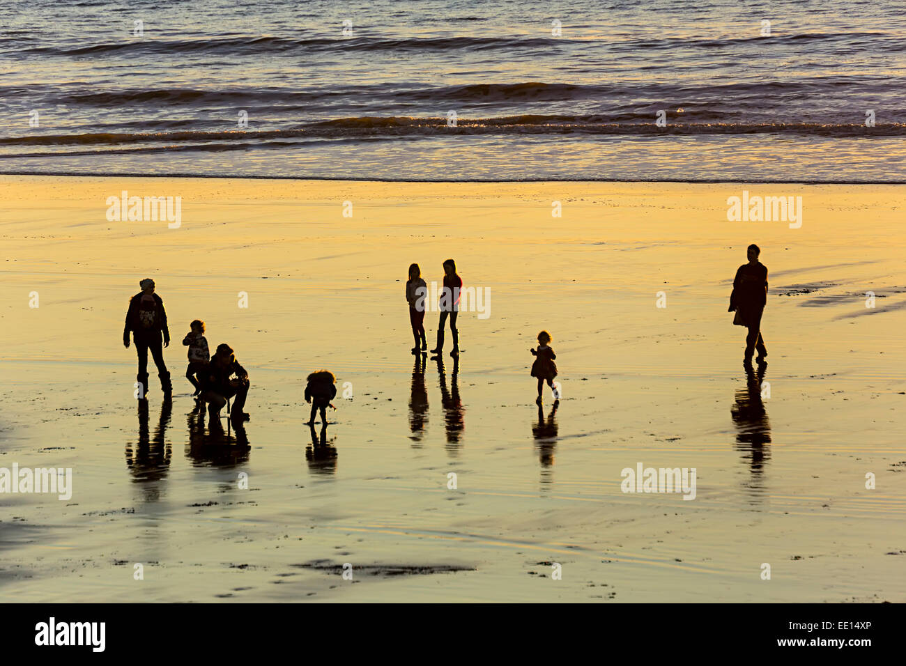 People on beach at low tide, Southerndown, Glamorgan Heritage Coast, Wales, UK Stock Photo