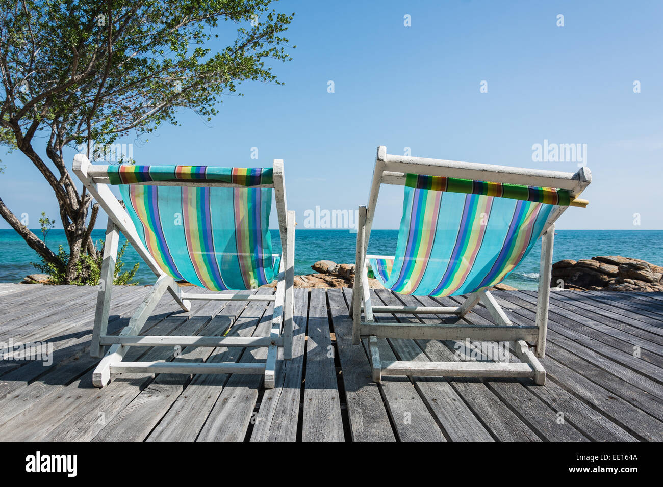 Two Beach Chairs with Wood Deck Stock Photo