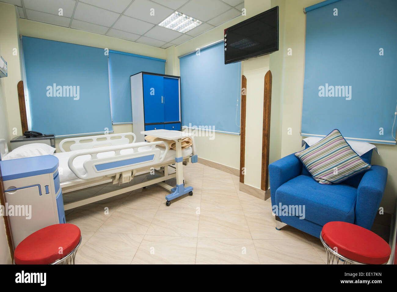 Bed in a private hospital medical center ward room Stock Photo