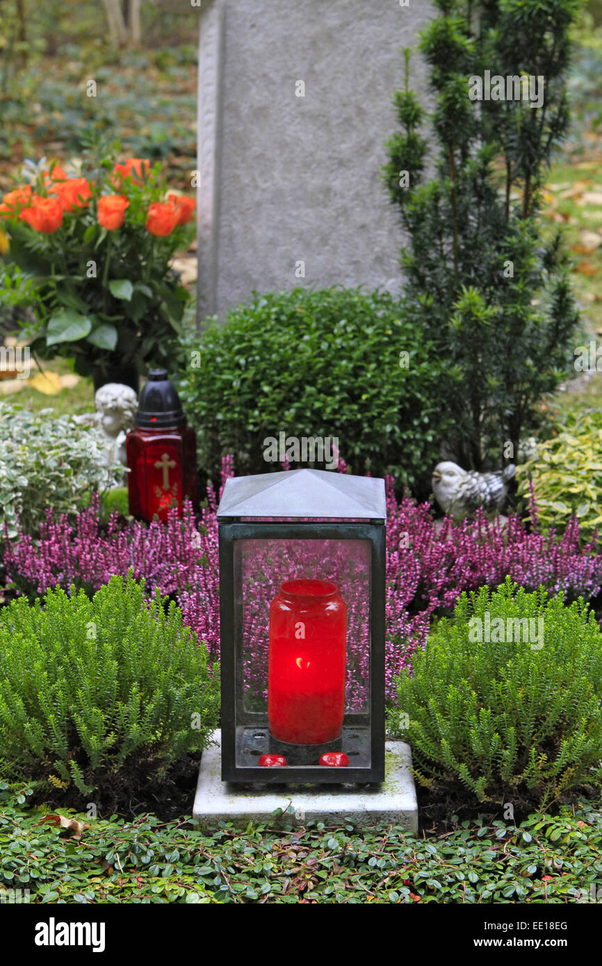 Geschmuecktes Grab auf einem Friedhof an Allerheiligen Stock Photo