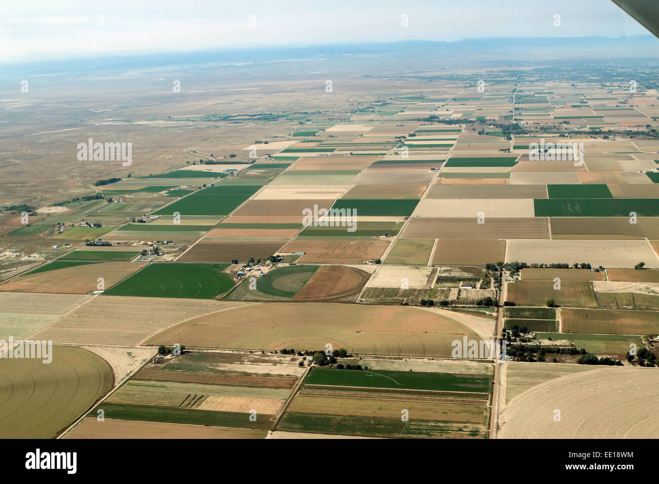 Irrigated farmlands near Avondale, Colorado. Just below the center point is a design in a crop - likely a corn maze. Stock Photo
