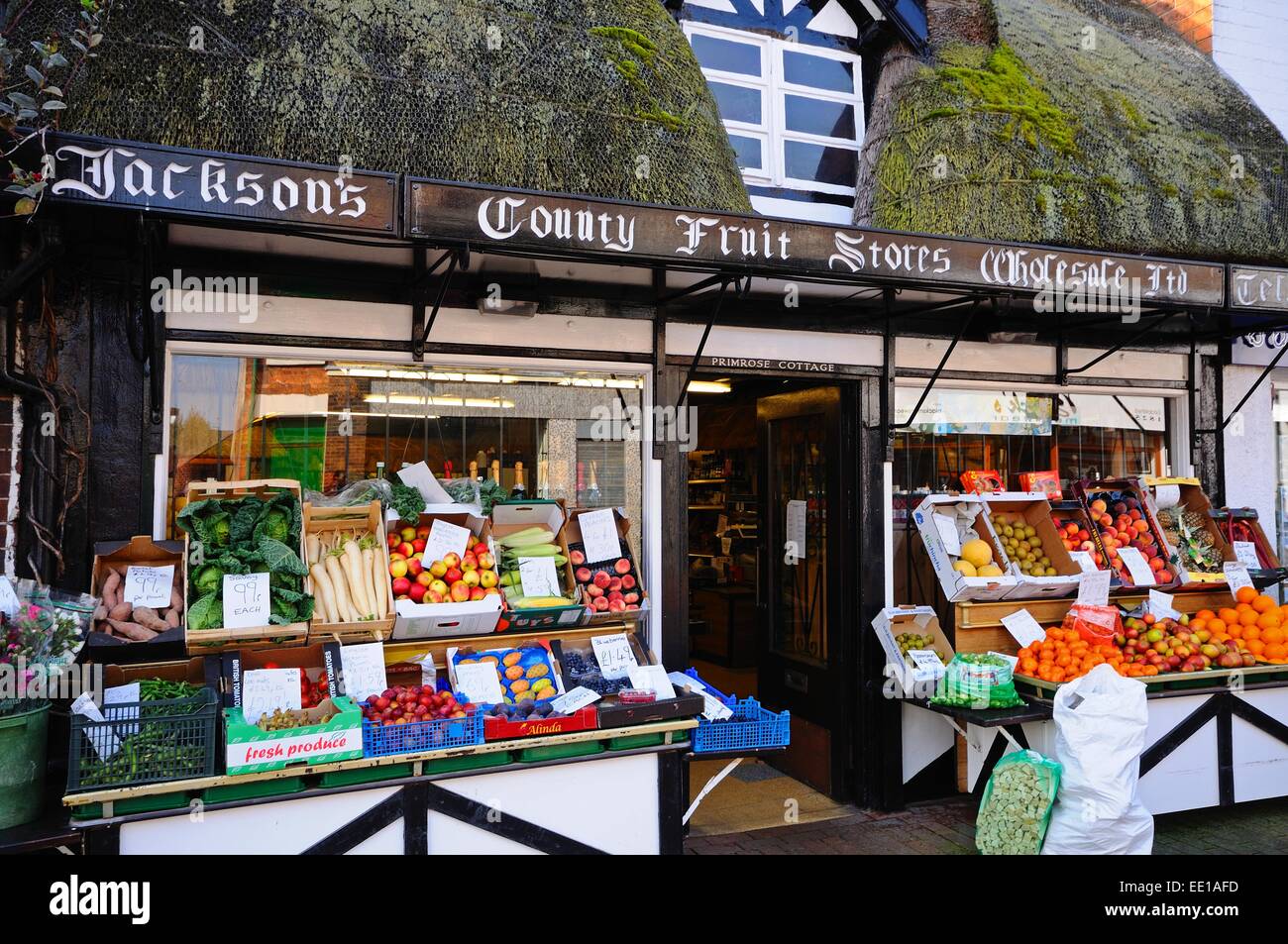 Fruit and vegetable shop in a thatched building along Mill Street in