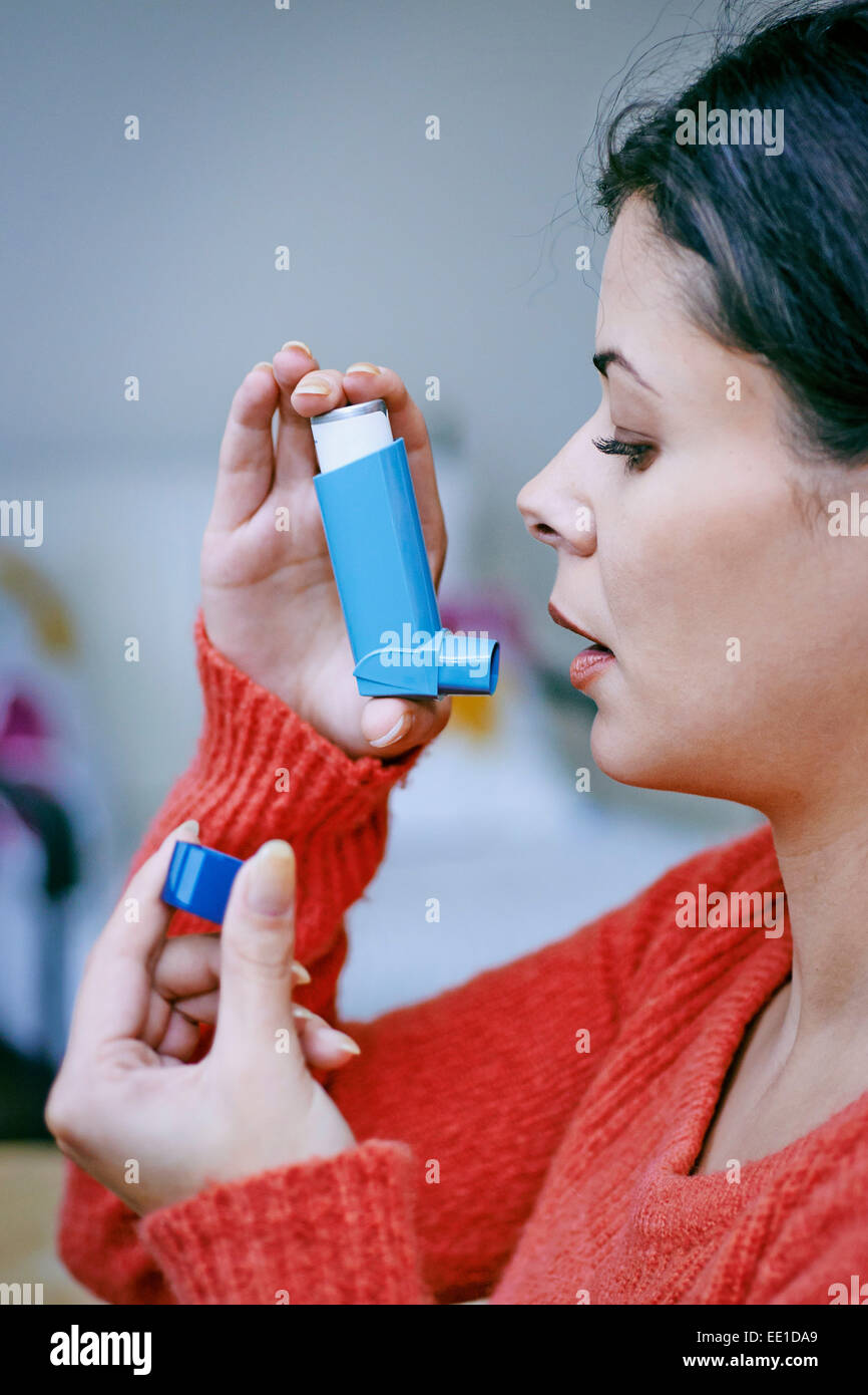 ASTHMA TREATMENT, WOMAN Stock Photo