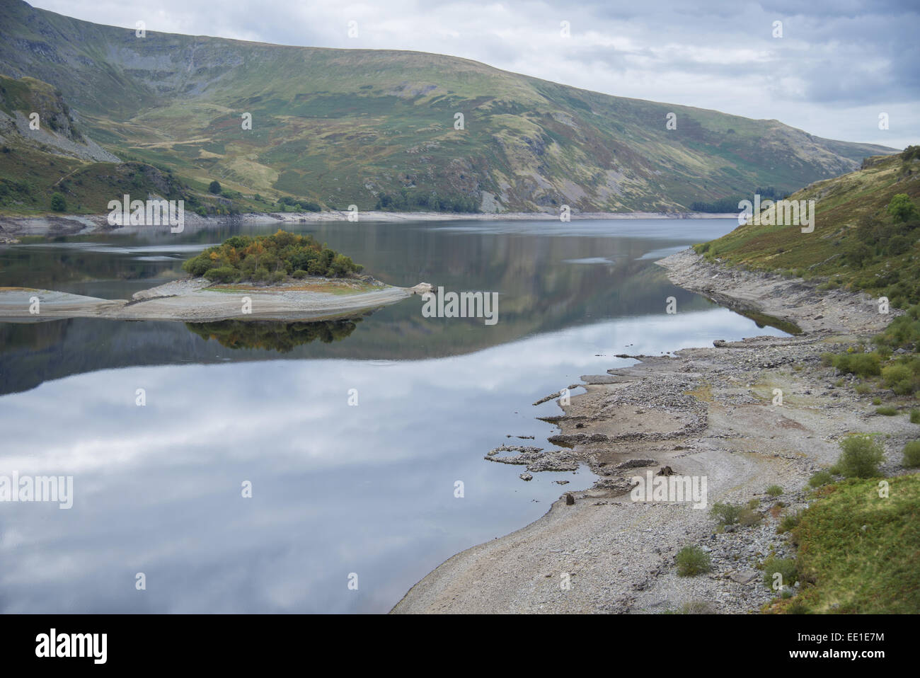 View of upland reservoir with low water level and remains of submerged village exposed after dry summer, Mardale Green, Haweswater Reservoir, Mardale Valley, Lake District, Cumbria, England, September Stock Photo