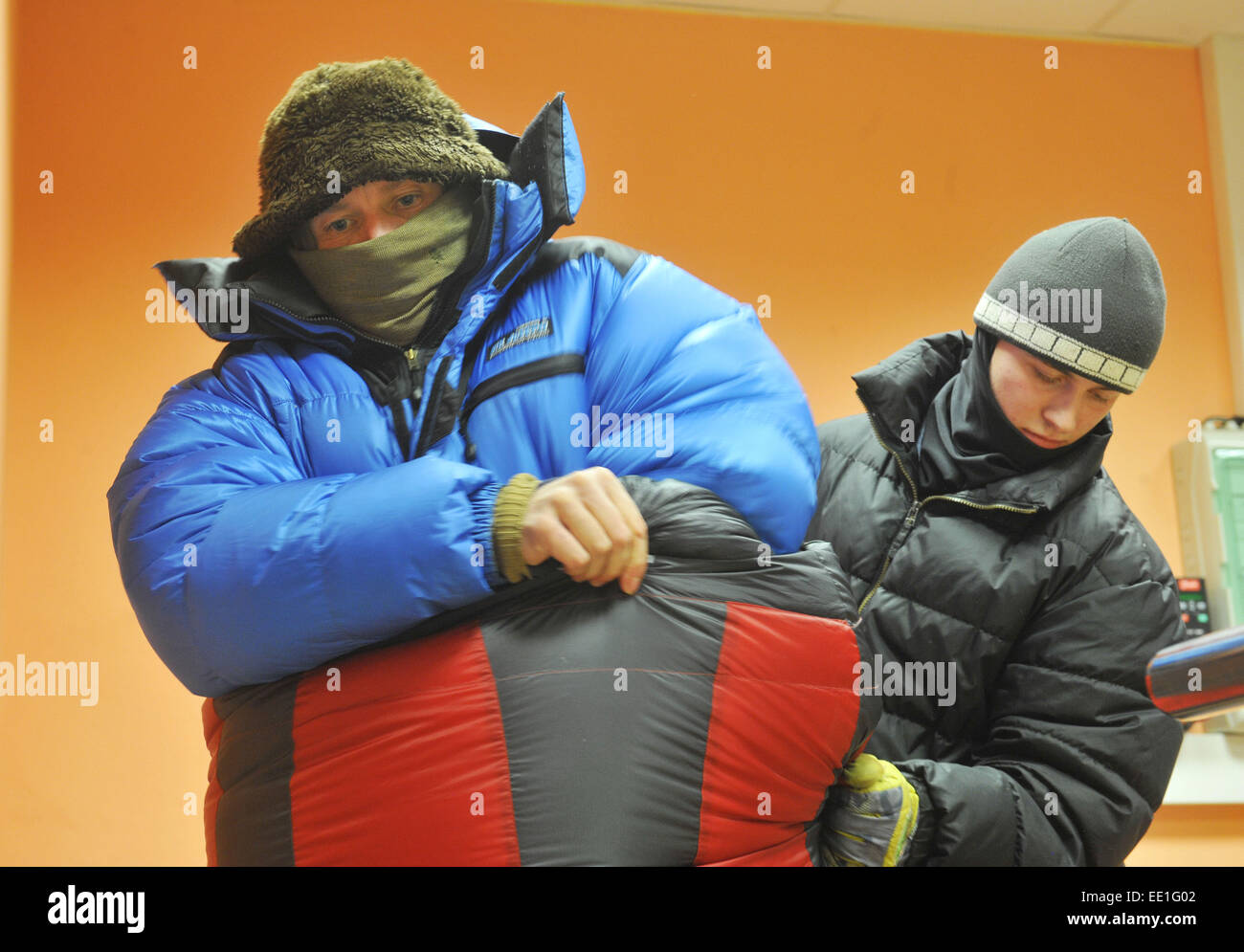 Czech globetrotter and adventurer Marek Simicek (in blue) managed to spend the record eight hours in a cryo chamber, dressed in sleeping bags, in minus 100 degrees Celsius today, on Monday, January 12, 2015. Simicek entered the special chamber in which one can create enormous frosts at 14:00 and left it in a good health condition at 22:00. Simicek, 39, decided to test his physical and mental condition, hardened by several walking expeditions to the Baikal area.After the hours spent in the bitter cold, Simicek complained that he felt too warm in it. Before today's try, he increased the number o Stock Photo