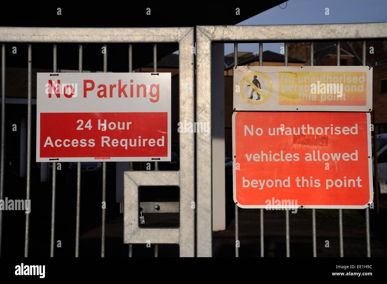 Parking restriction signage on metal gates Stock Photo Alamy