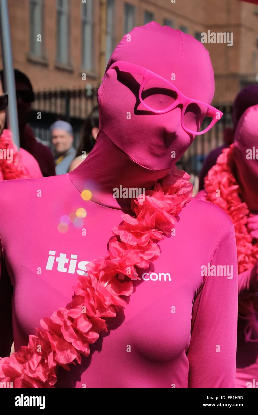 Woman dressed in skin tight pink whole body suit at the West end carnival Stock Photo