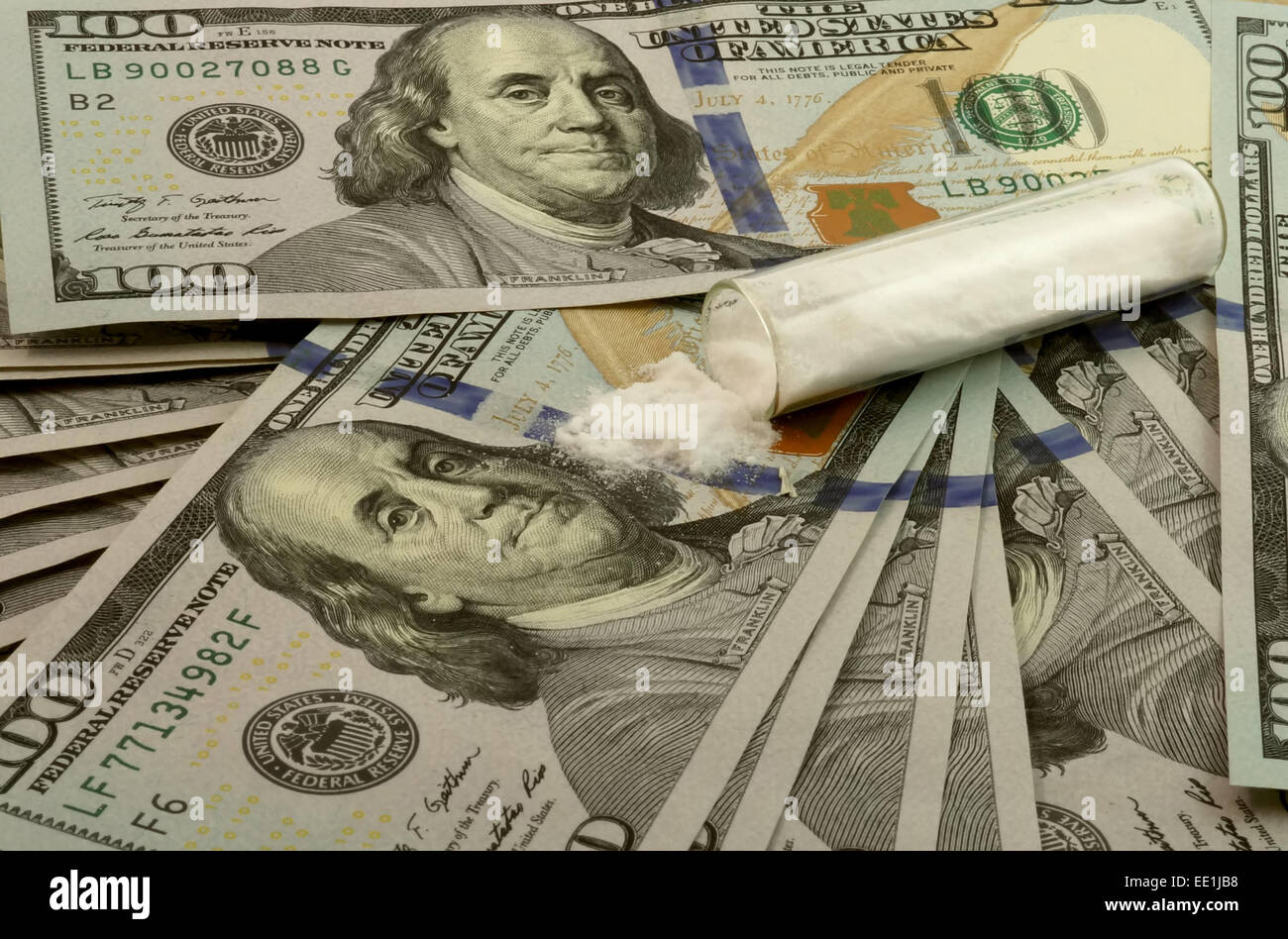 100 dollar bills with a pile of white powder. Drugs Stock Photo