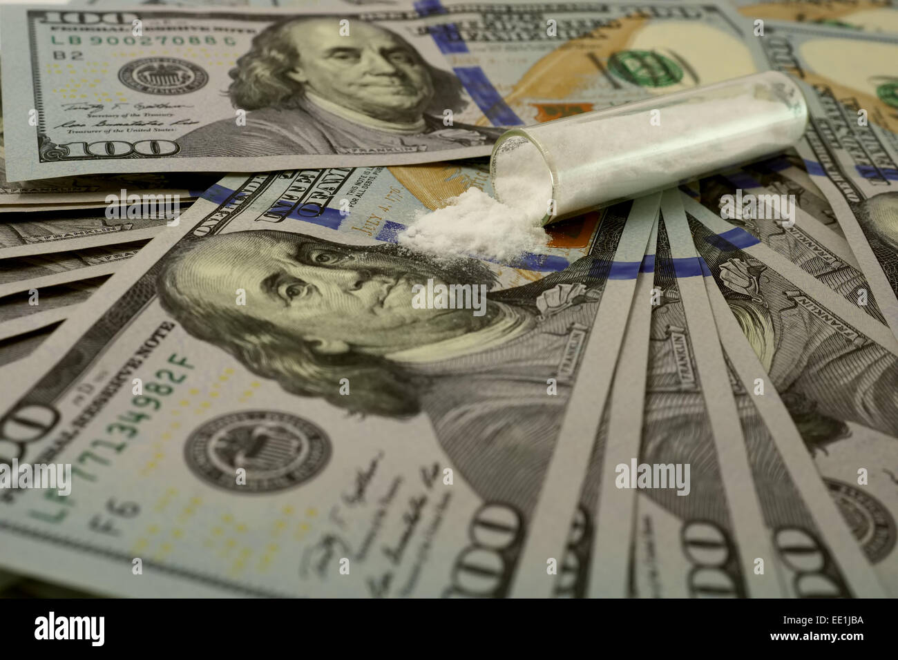 100 dollar bills with a pile of white powder. Drugs Stock Photo